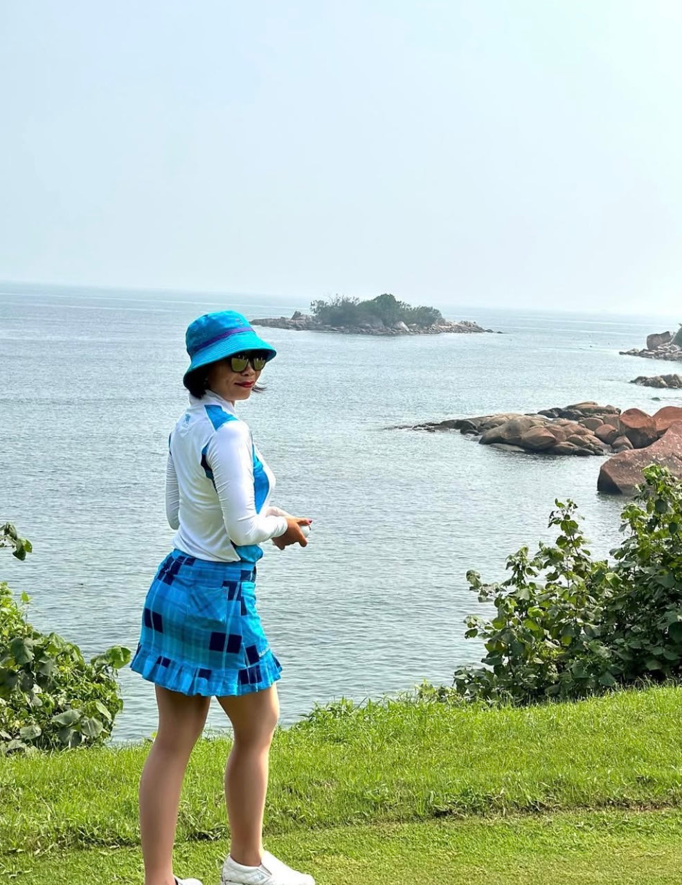 LGS-020D || Golf Set – Top White Long Sleeve Mandarin / Vee Neck Zip Fastened Mid Blue Tartan Breathable Side & Shoulder Panels with Mid and Dark Blue Tartan Skirt Button Waist Fastening Two Front & One Rear Pockets Contoured Pleated Short Hem