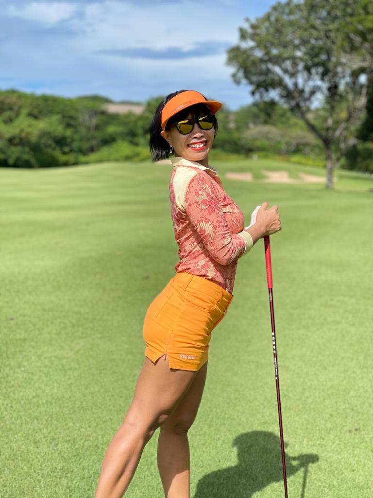 LT-090D || Ladies Top Light Orange and Dark Orange Flower Pattern with Light Green Trim 3/4 Sleeves and Snap Pearl Buttons.