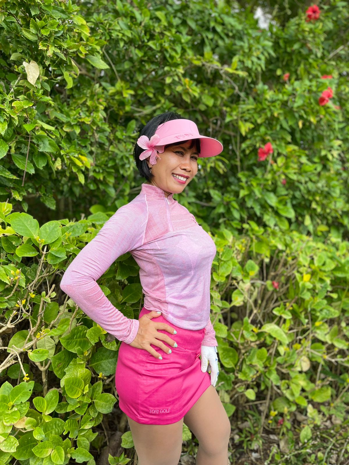 LS-063E || Ladies skirt dark pink with silvery pink faux embossed motif one white piped vert stripe 3 buttons concealing zip fastening 2 rear pockets one front pocket .