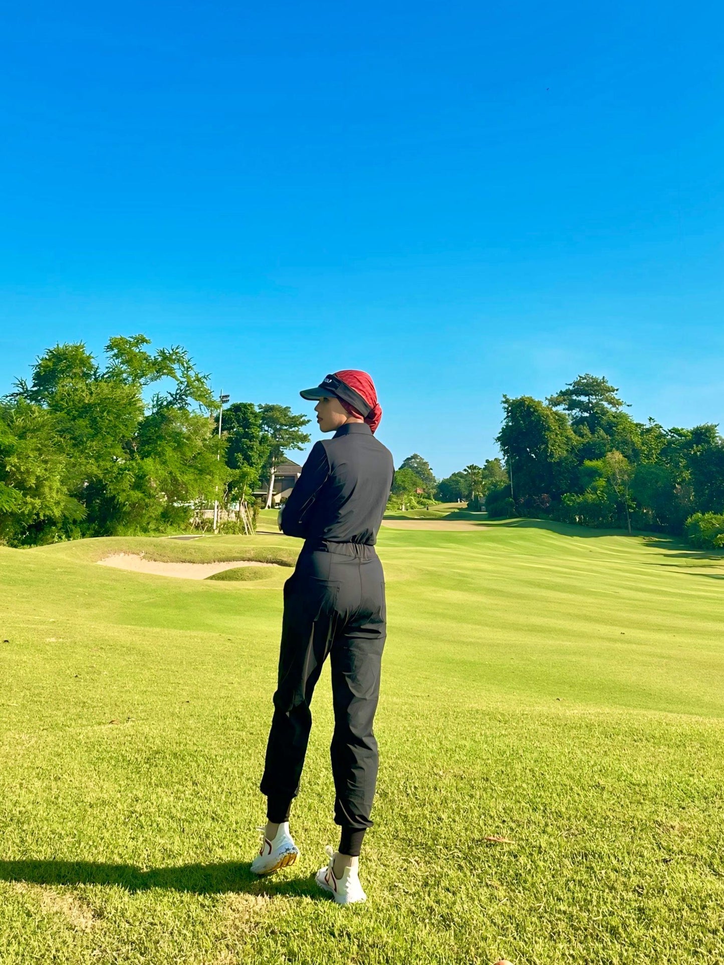LJS-001 || Ladies Golf Jumpsuit Long Sleeve with Collar Neck Black Color and Long Pants, with a Zipper in Front and 2 Pockets on The Right and Left of The Chest and Elastic Band on The Waist