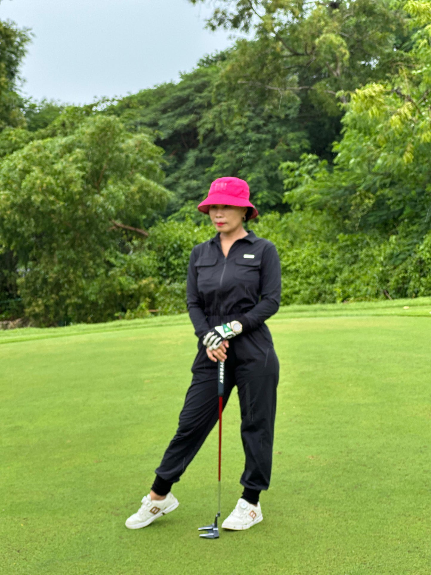 LJS-001 || Ladies Golf Jumpsuit Long Sleeve with Collar Neck Black Color and Long Pants, with a Zipper in Front and 2 Pockets on The Right and Left of The Chest and Elastic Band on The Waist
