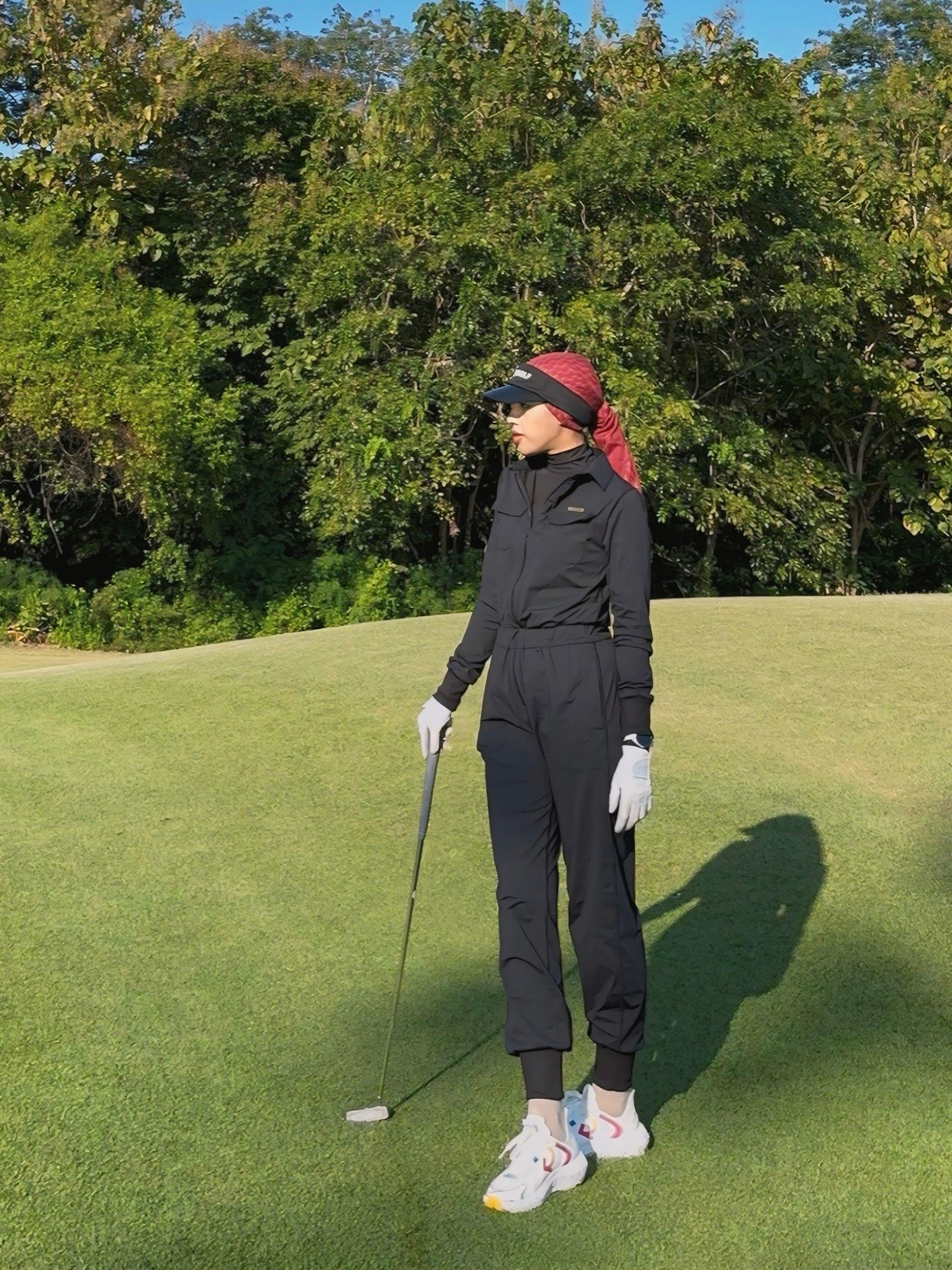 LJS-001 || Ladies Golf Jumpsuit Long Sleeve with Collar Neck Black Color and Long Pants, with a Zipper in Front and 2 Pockets on The Right and Left of The Chest and Elastic Band on The Waist