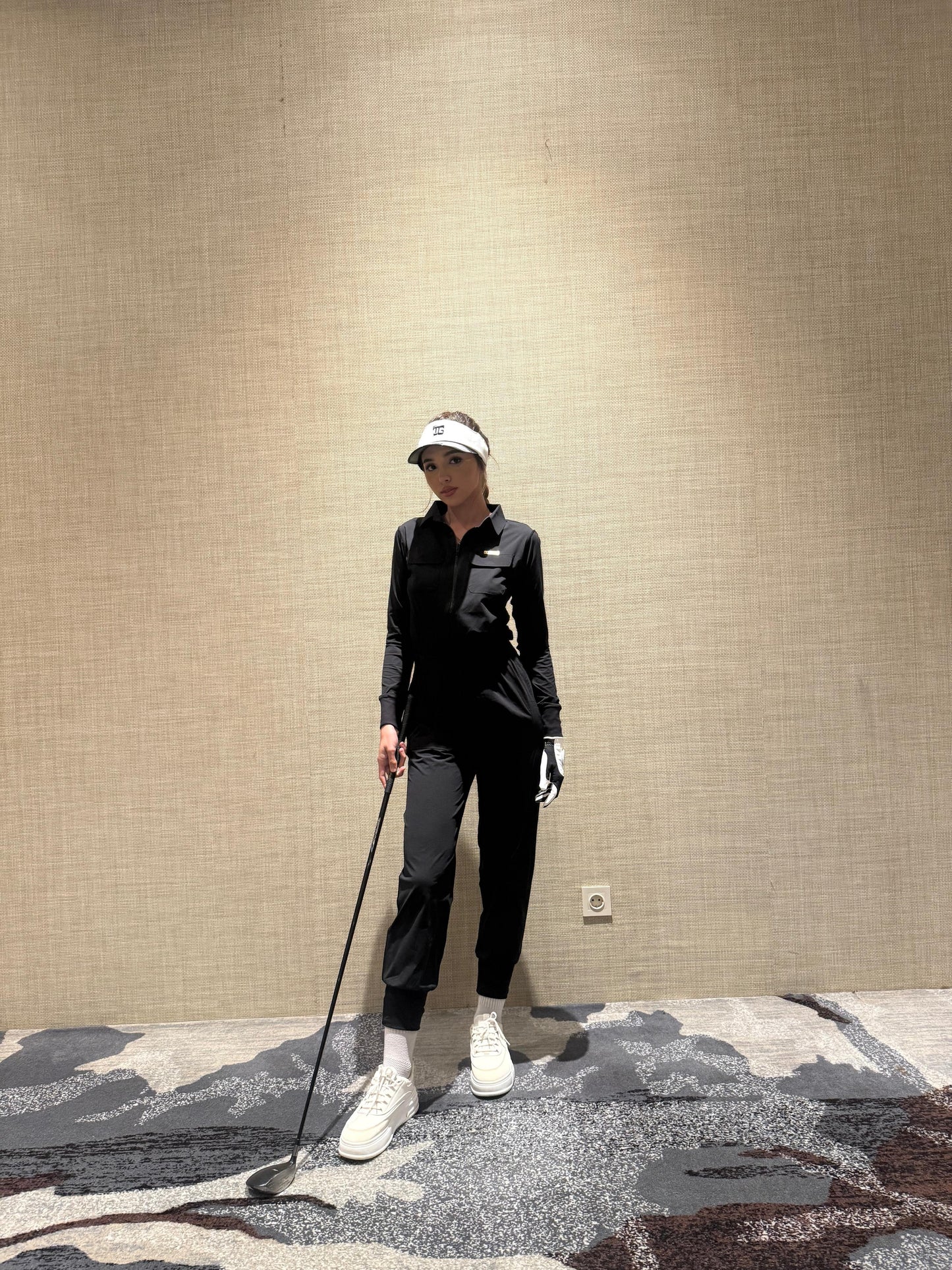 LJS-001 || Ladies Golf Jumpsuit Long Sleeve with Collar Neck Black Color and Long Pants, with a Zipper in Front and 2 Pockets on The Right and Left of The Chest and Elastic Band on The Waist