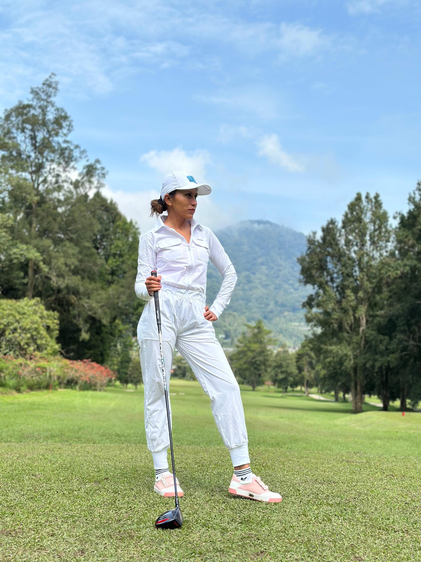 LJS-001A || Ladies Golf Jumpsuit Long Sleeve with Collar Neck White Color and Long Pants, with a Zipper in Front and 2 Pockets on The Right and Left of The Chest and Elastic Band on The Waist.