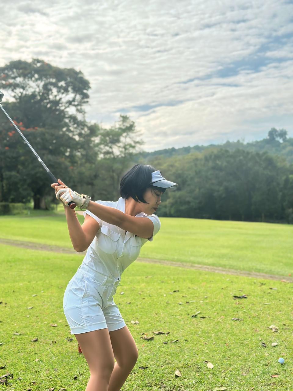 LJS-003A || Ladies Golf Jumpsuit White Color with Shawl Sollar, Short Sleeves with Shorts and Buttons in Front and 2 Pockets on the Right and Left Sides of the Front Chest