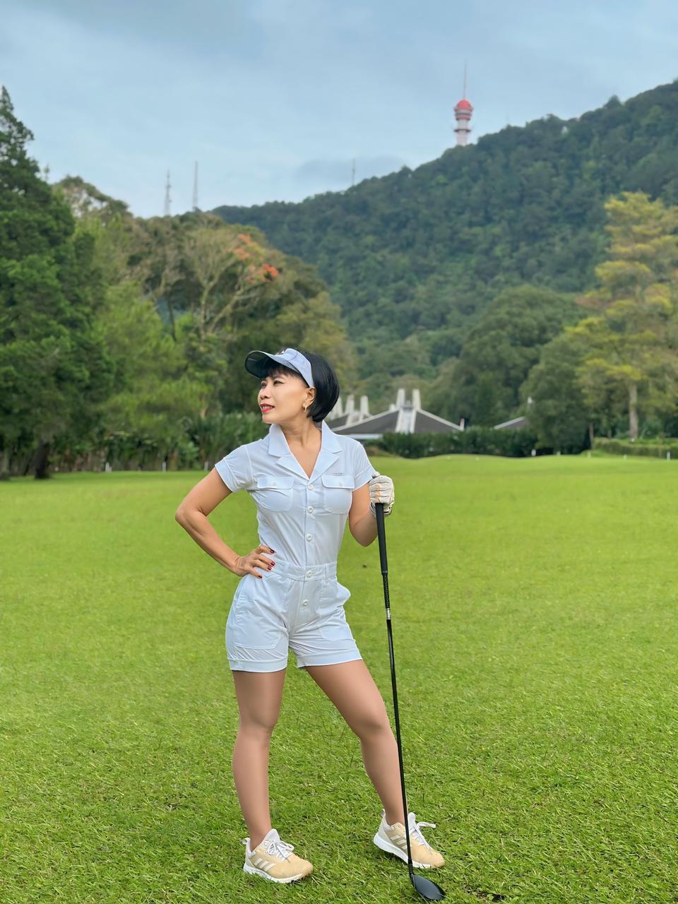 LJS-003A || Ladies Golf Jumpsuit White Color with Shawl Sollar, Short Sleeves with Shorts and Buttons in Front and 2 Pockets on the Right and Left Sides of the Front Chest