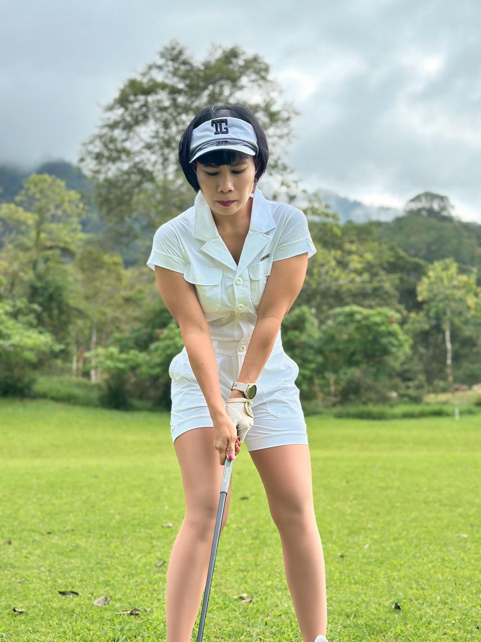 LJS-003A || Ladies Golf Jumpsuit White Color with Shawl Sollar, Short Sleeves with Shorts and Buttons in Front and 2 Pockets on the Right and Left Sides of the Front Chest