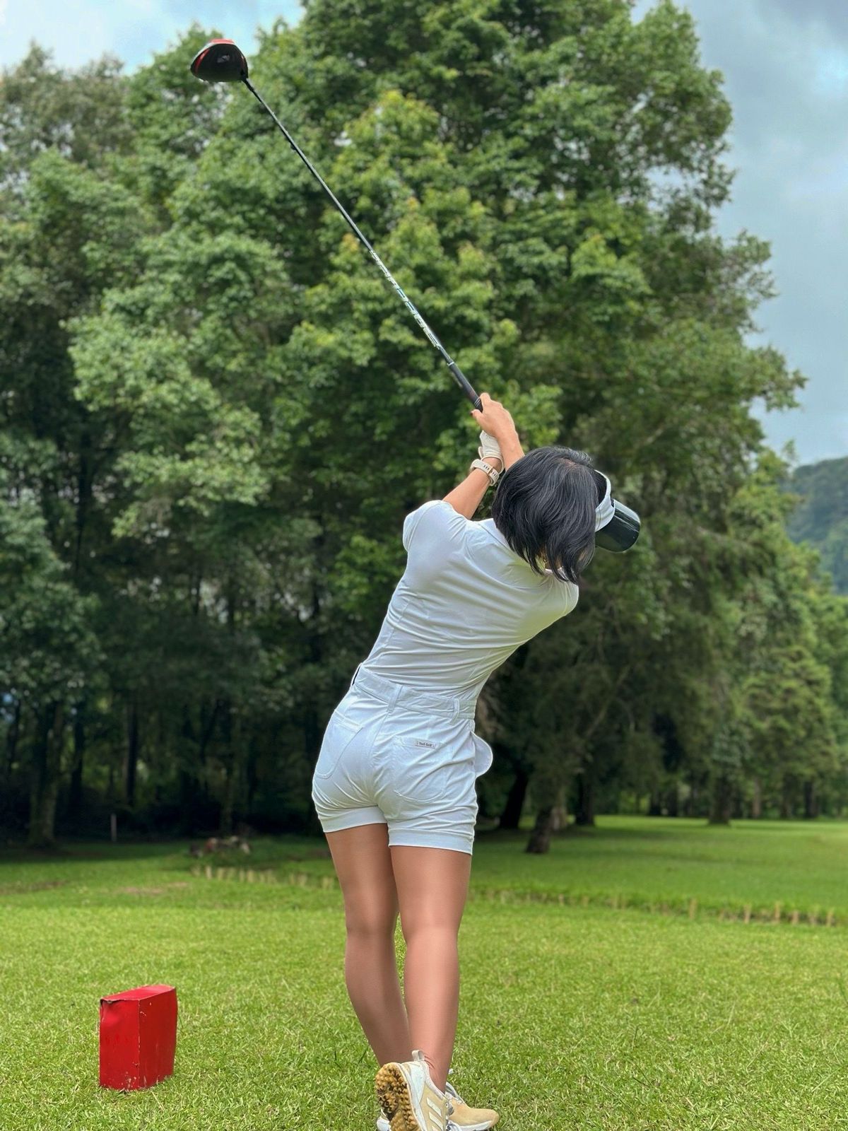 LJS-003A || Ladies Golf Jumpsuit White Color with Shawl Sollar, Short Sleeves with Shorts and Buttons in Front and 2 Pockets on the Right and Left Sides of the Front Chest