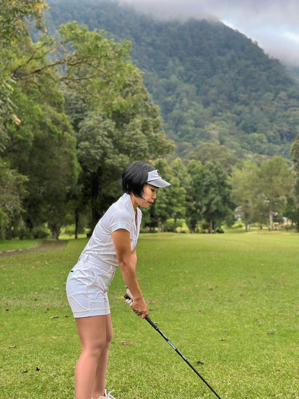 LJS-003A || Ladies Golf Jumpsuit White Color with Shawl Sollar, Short Sleeves with Shorts and Buttons in Front and 2 Pockets on the Right and Left Sides of the Front Chest