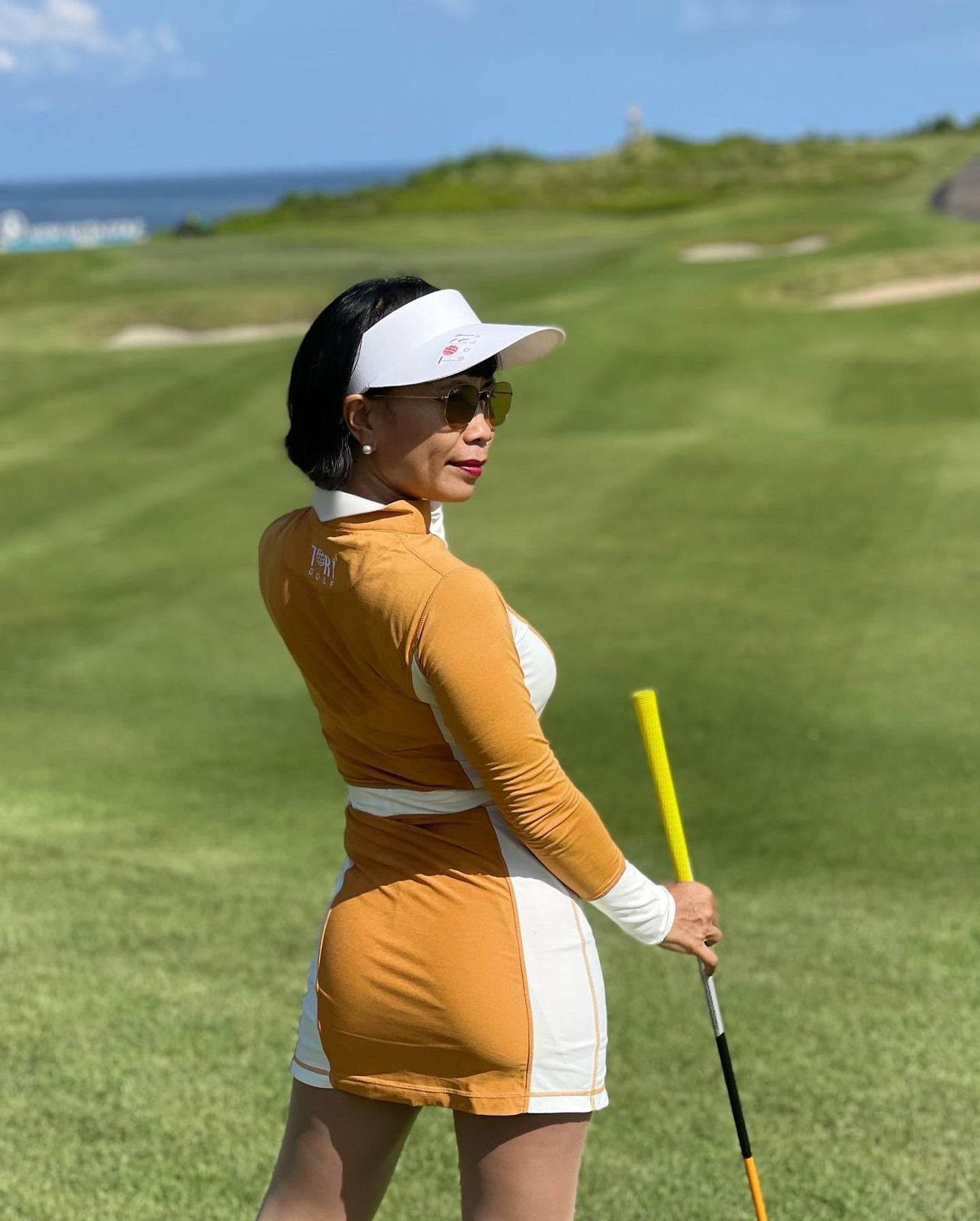 GD-016A || Golf Dress Long Sleeve Orange Mustard With White Half Belted Waist Cuff Belted Under Arm Side Pannel Zipper Mandarin Type Collar With Peacked Back Section